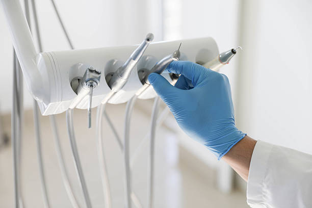 Professional Tooth Extraction technician working in Harrison, TN